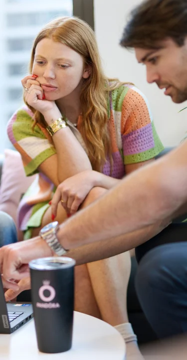 Diverse professionals engaged in a corporate meeting around a table.
